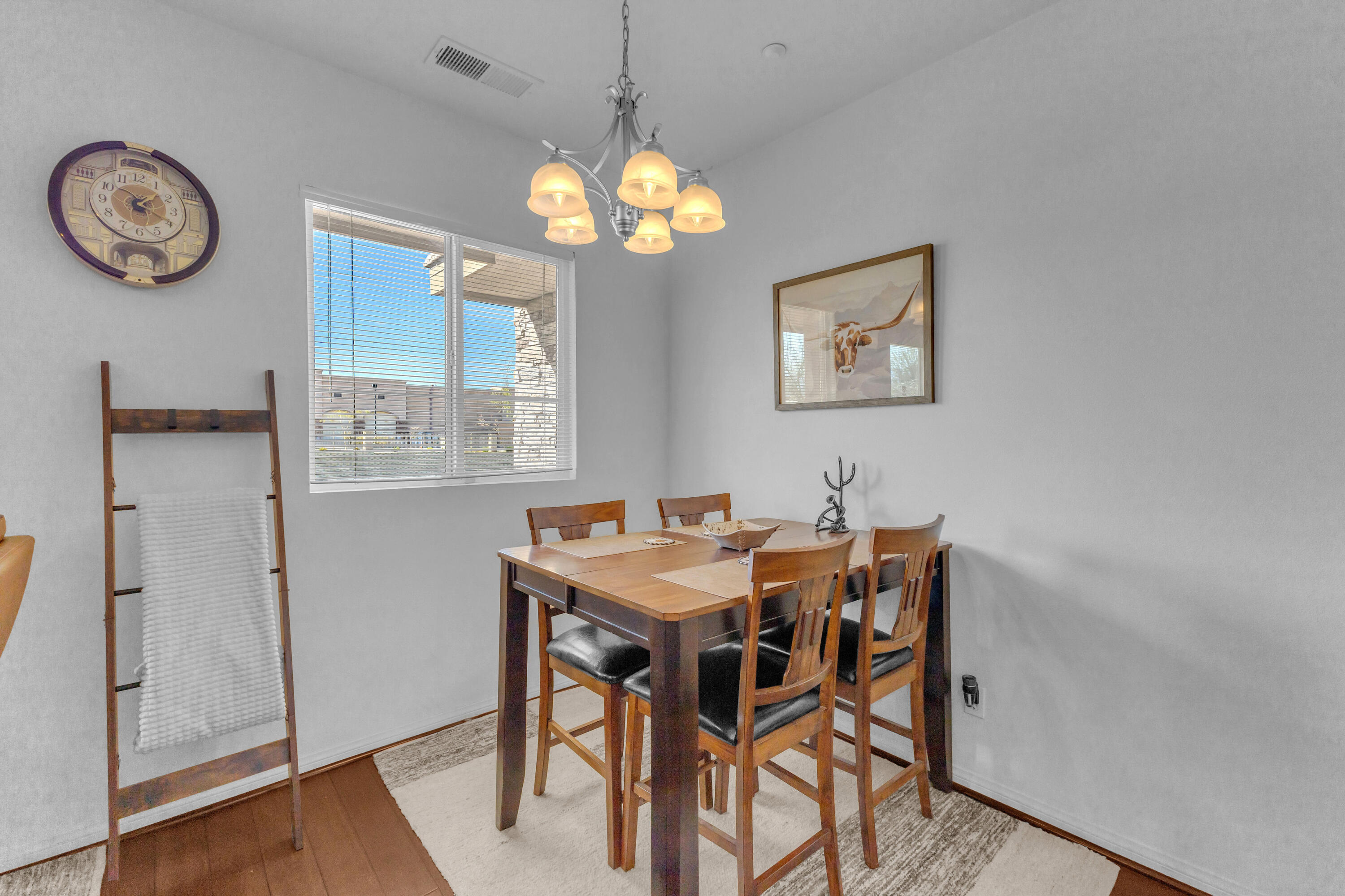 73268 Azure Rain, Unit 102 Palm Desert, CA 92211 - Photo 24 of 44 a view of a dining room with furniture window and wooden floor