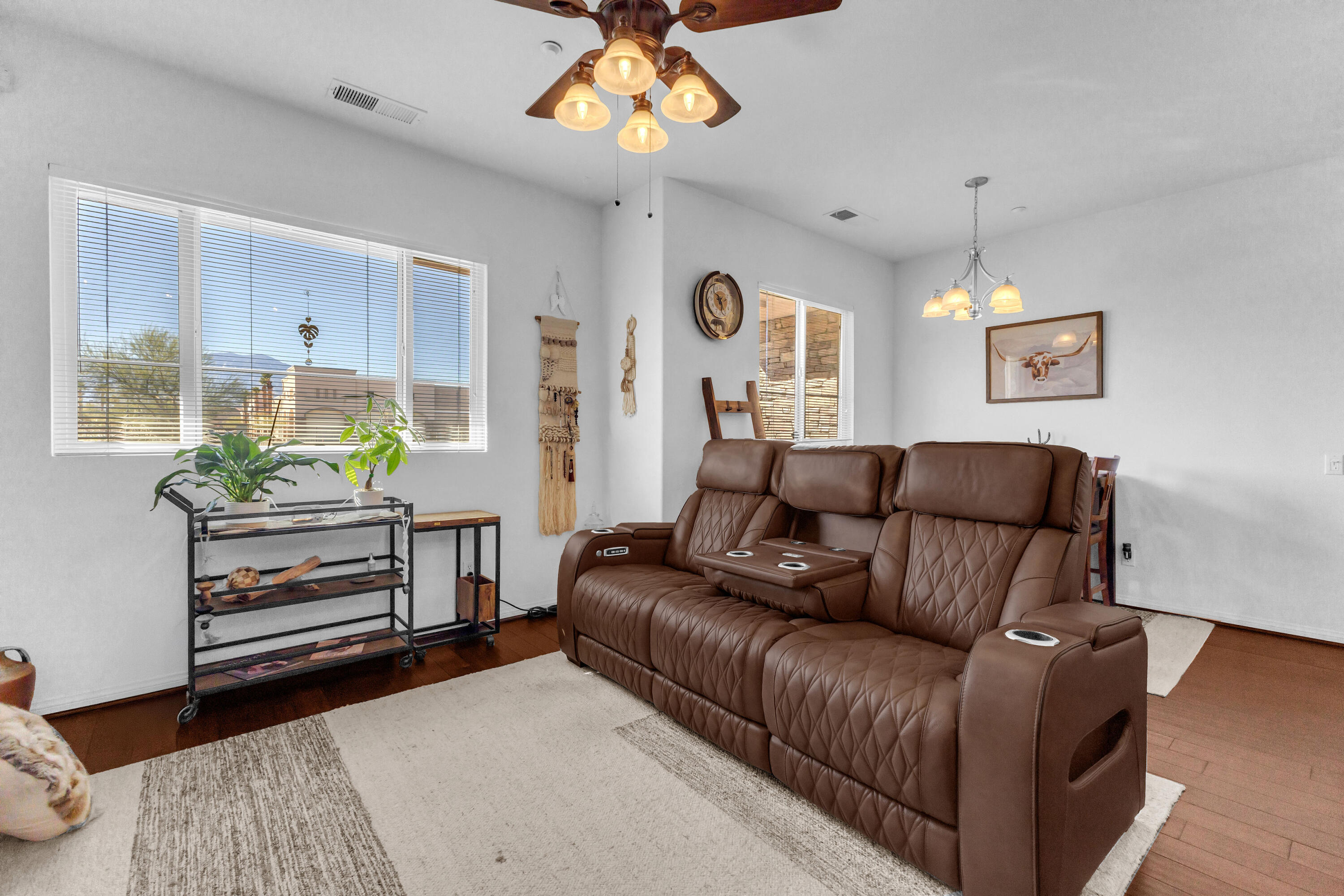 73268 Azure Rain, Unit 102 Palm Desert, CA 92211 - Photo 25 of 44 a living room with furniture a chandelier and a window