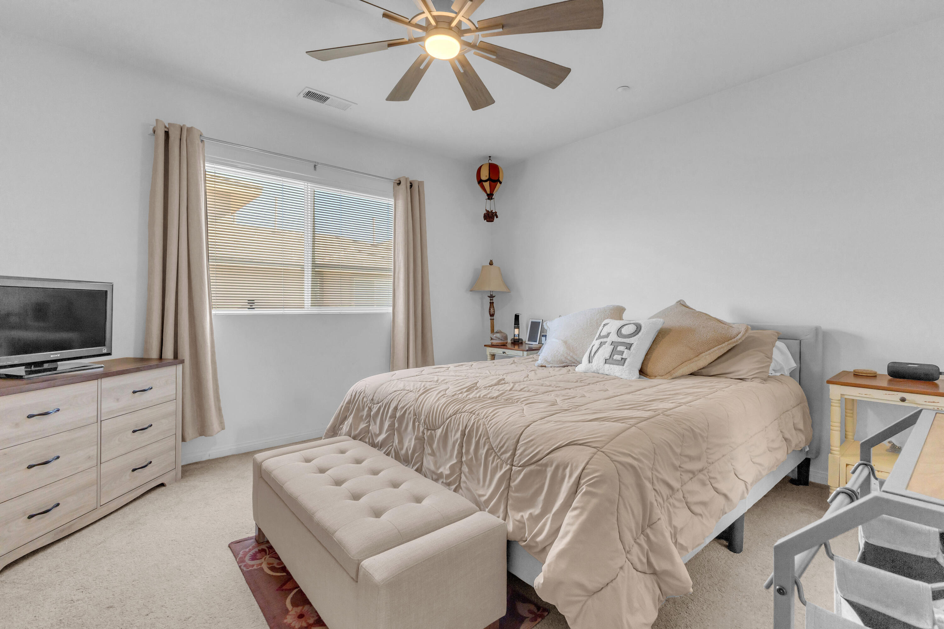 73268 Azure Rain, Unit 102 Palm Desert, CA 92211 - Photo 27 of 44 a bedroom with a bed and a television