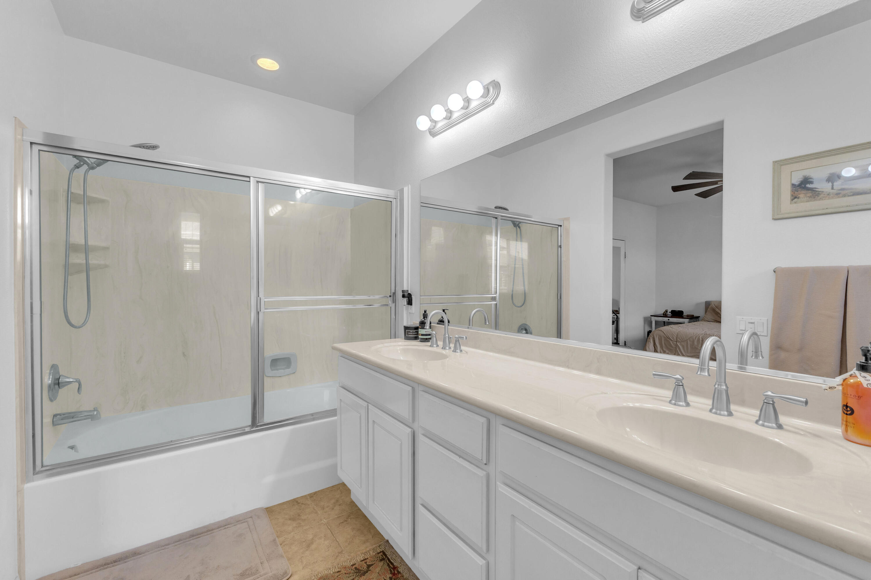 73268 Azure Rain, Unit 102 Palm Desert, CA 92211 - Photo 31 of 44 a bathroom with a double vanity sink mirror double and shower