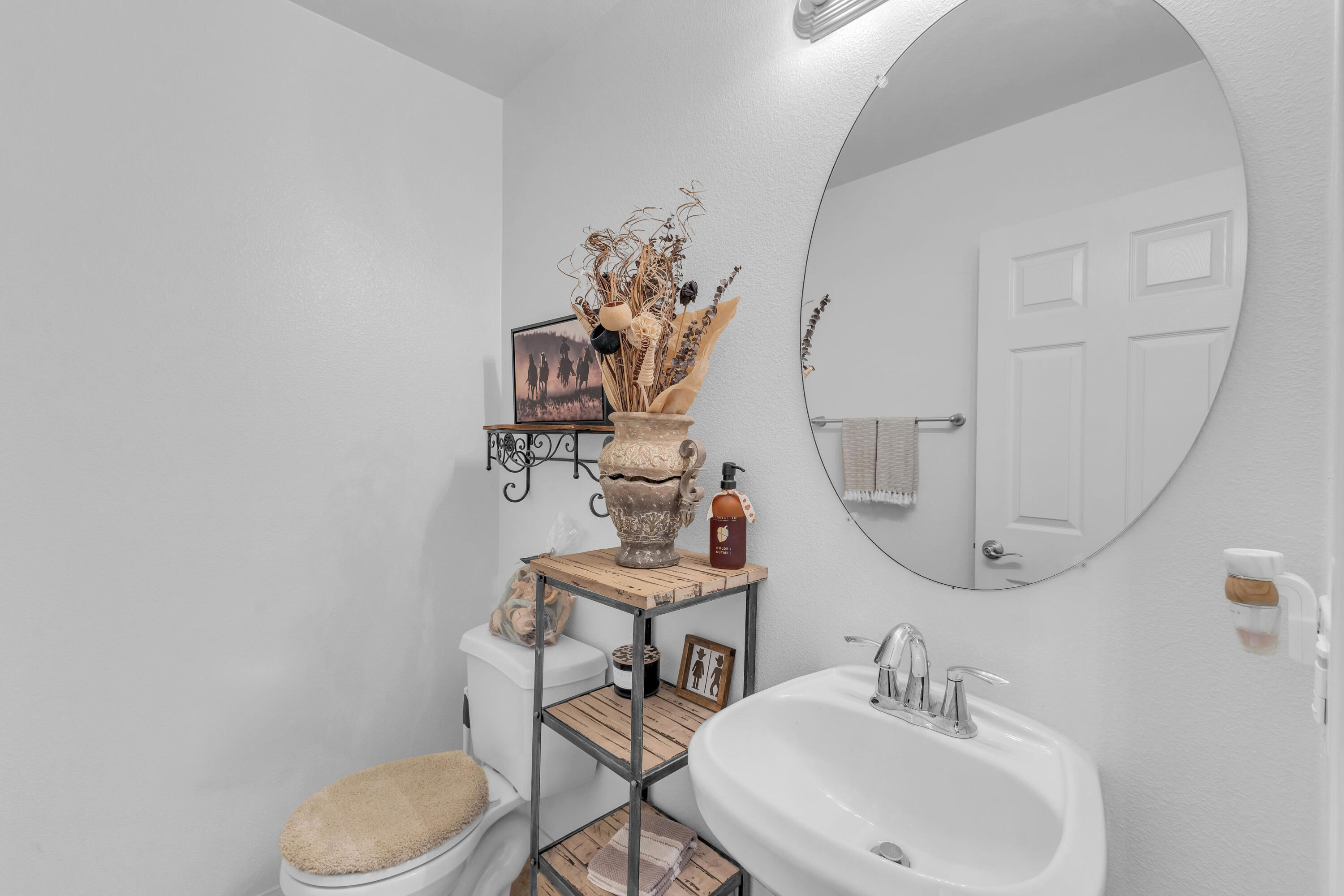 73268 Azure Rain, Unit 102 Palm Desert, CA 92211 - Photo 32 of 44 a bathroom with a toilet sink and mirror