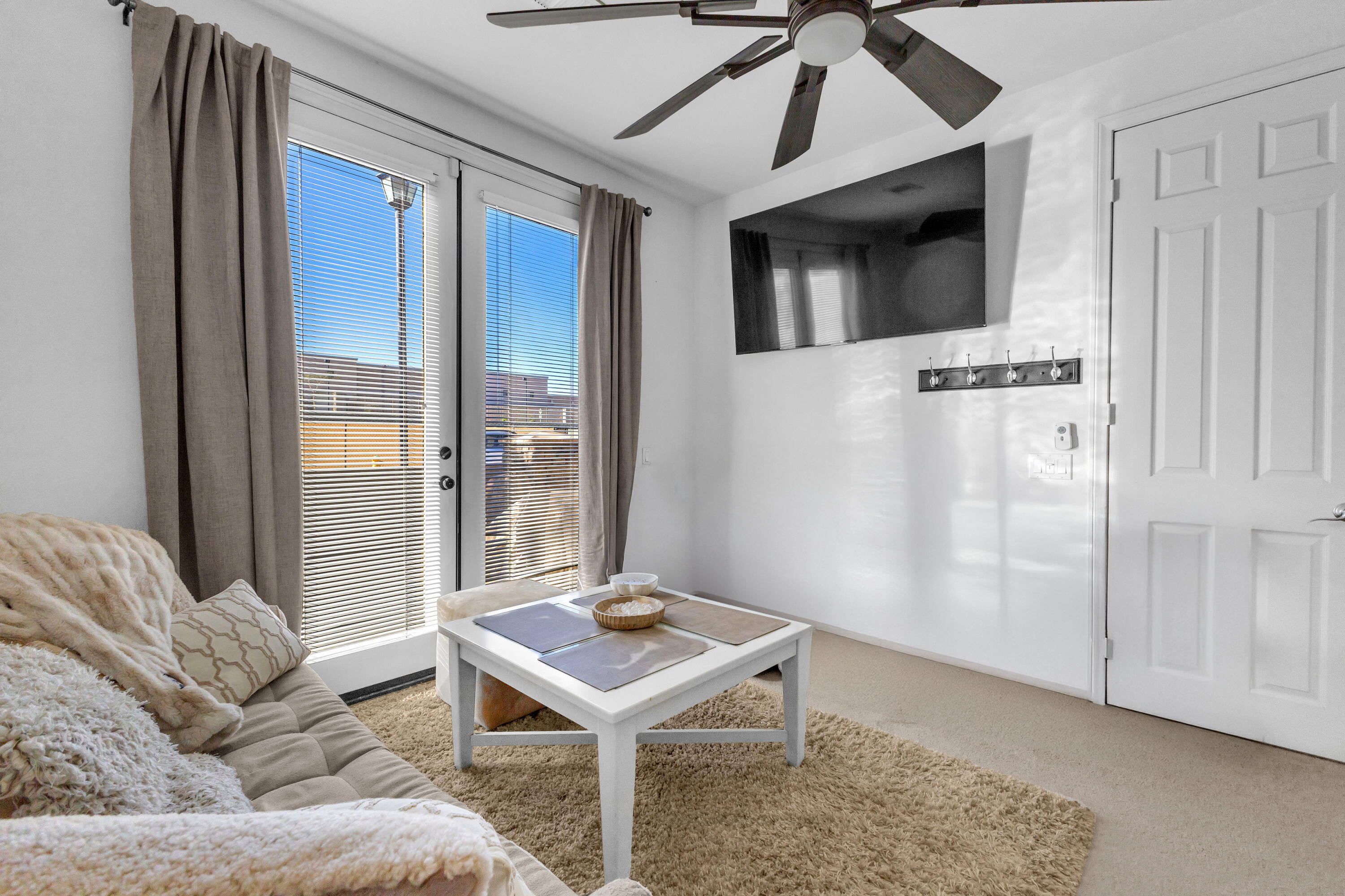 73268 Azure Rain, Unit 102 Palm Desert, CA 92211 - Photo 5 of 44 a living room with furniture and a flat screen tv