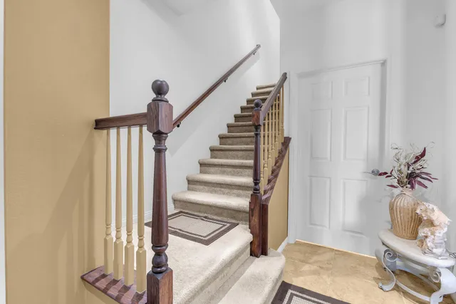 a view of kitchen with cabinets table and chairs