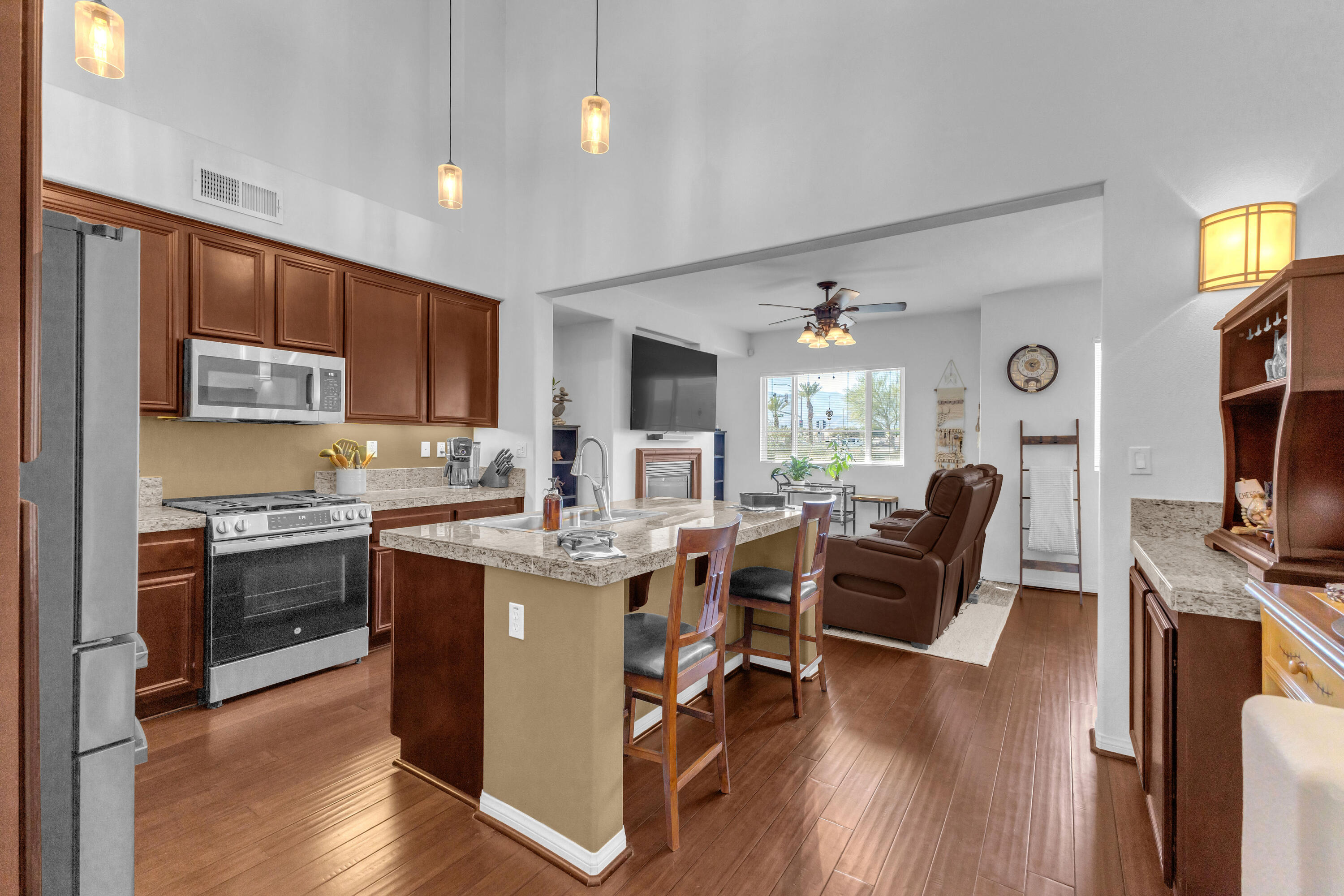 73268 Azure Rain, Unit 102 Palm Desert, CA 92211 - Photo 10 of 44 a view of kitchen with cabinets table and chairs