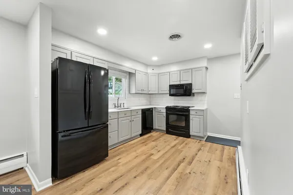 a view of a livingroom with wooden floor