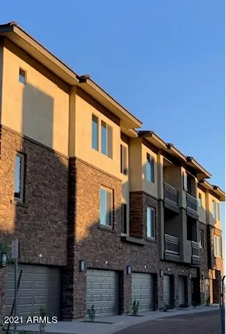 a front view of a house with parking