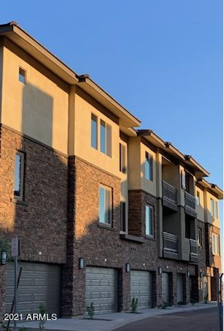 a front view of a house with parking