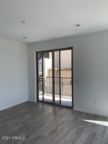 17850 North 68th Street, Unit 2063 Phoenix, AZ 85054 - Photo 15 of 23 wooden floor in an empty room with a window