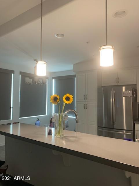 17850 North 68th Street, Unit 2063 Phoenix, AZ 85054 - Photo 16 of 23 a bathroom with a sink and a mirror