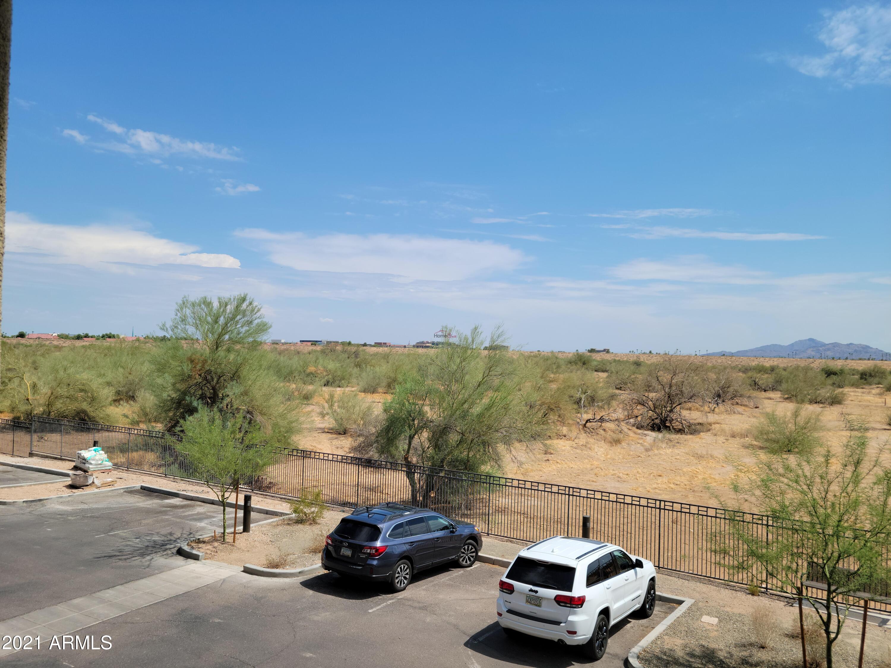 17850 North 68th Street, Unit 2063 Phoenix, AZ 85054 - Photo 23 of 23 a car parked on the side of the road