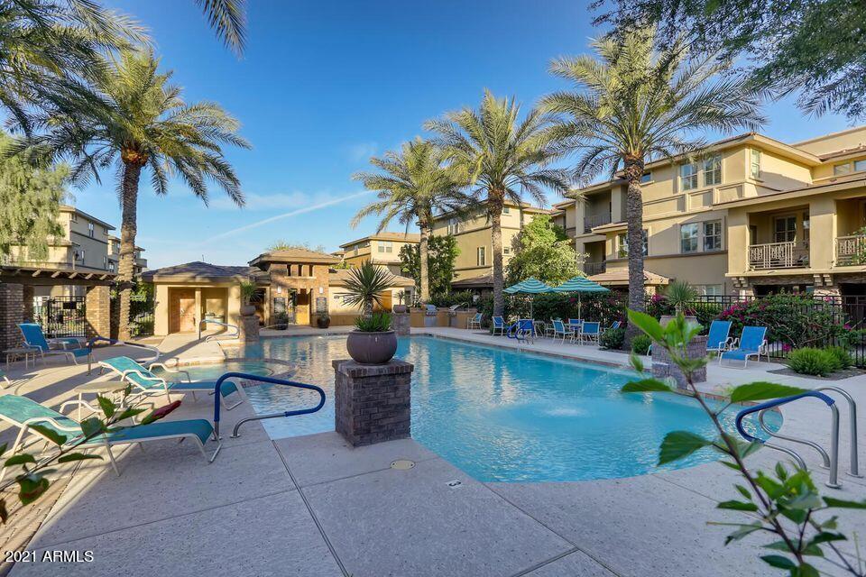 17850 North 68th Street, Unit 2063 Phoenix, AZ 85054 - Photo 3 of 23 a view of multiple houses with swimming pool