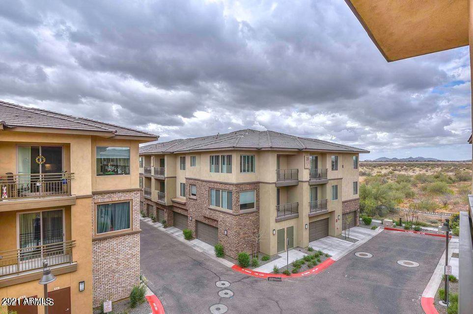 17850 North 68th Street, Unit 2063 Phoenix, AZ 85054 - Photo 6 of 23 a front view of a house with a yard