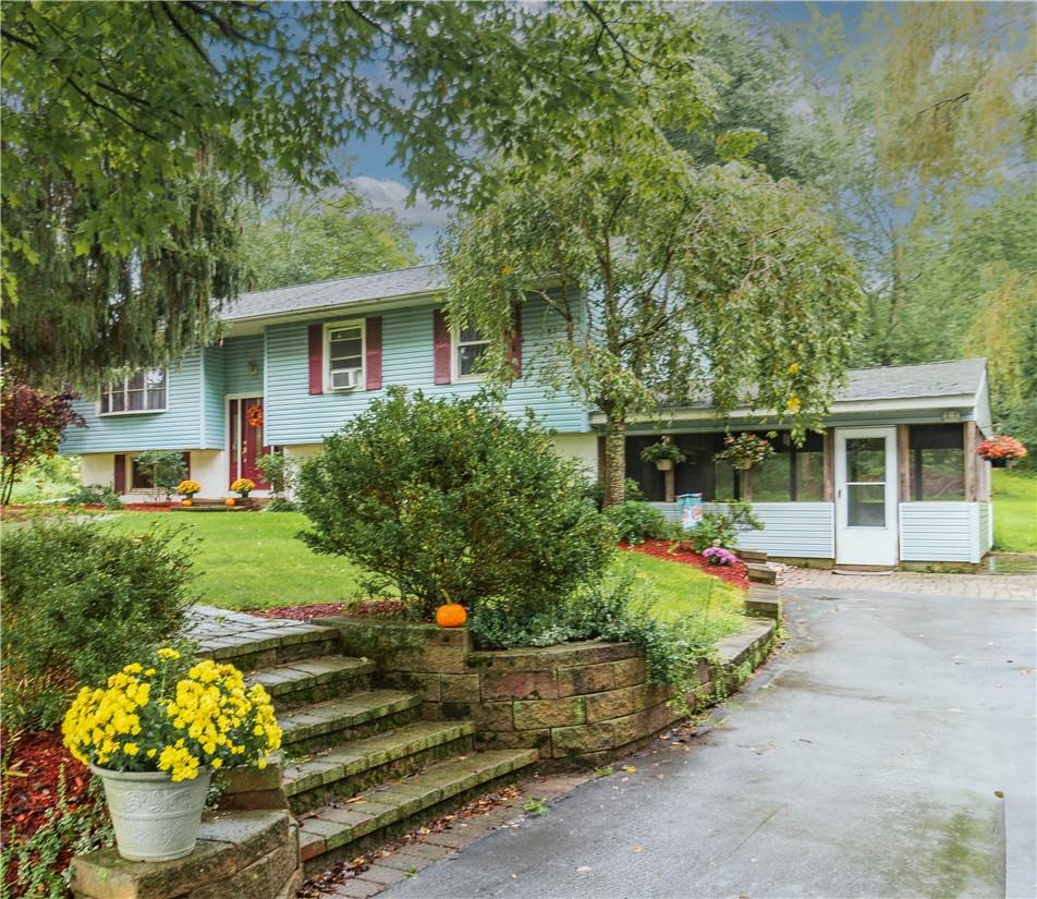 front view of a house with a yard