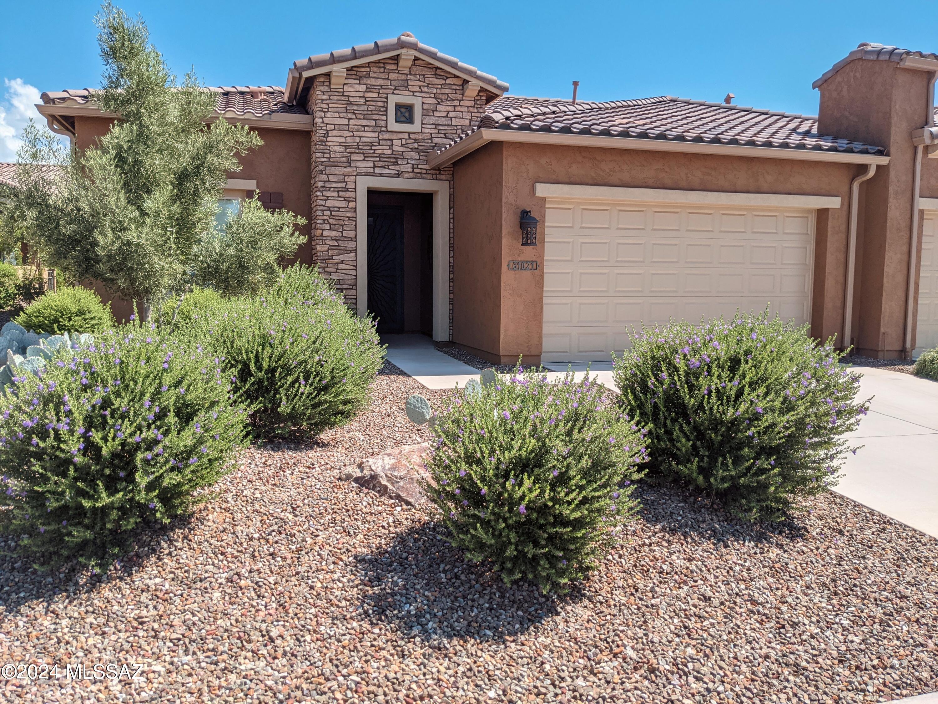 61021 East Slate Road Oracle, AZ 85623 - Photo 2 of 18 a front view of a house with a yard