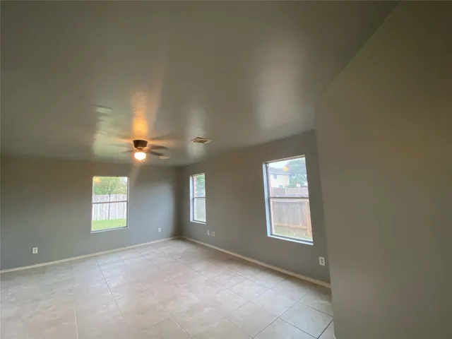a kitchen with stainless steel appliances a stove a sink and a refrigerator