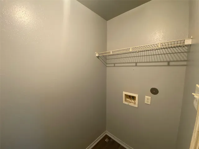 a bathroom with a granite countertop shower and a toilet