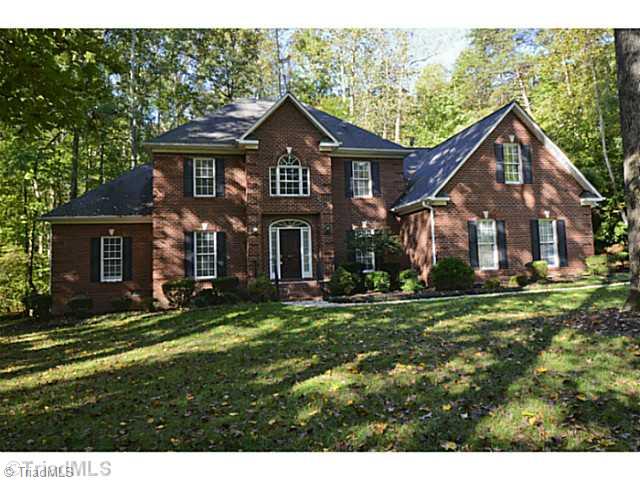 1807 Wild Fern Drive Oak Ridge, NC 27310 - Photo 1 of 16 Exterior Front. Stately all brick home sits on large private lot