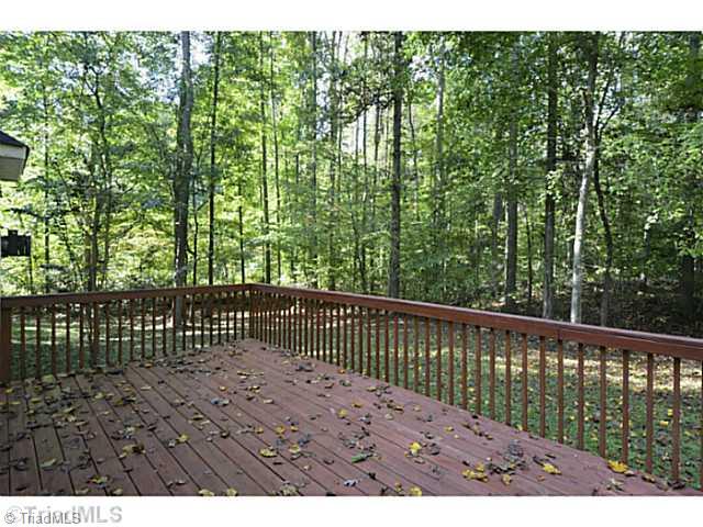 1807 Wild Fern Drive Oak Ridge, NC 27310 - Photo 14 of 16 Patio/Deck. Enjoy complete privacy on the back deck with beautiful woods on the perimeter of the lot