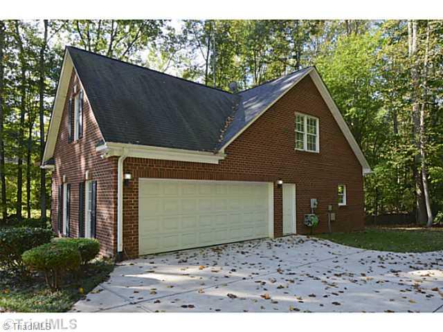 1807 Wild Fern Drive Oak Ridge, NC 27310 - Photo 15 of 16 Parking Lot/Garage. Long driveway leading to side entry garage. Home has large front yard and sits far off the road