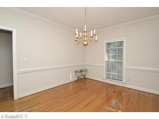 1807 Wild Fern Drive Oak Ridge, NC 27310 - Photo 3 of 16 Dining Room. Large dining room with chair railing