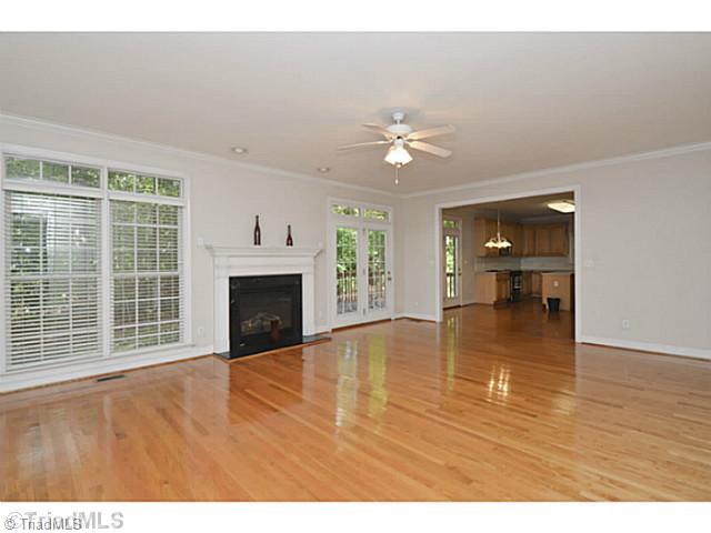 1807 Wild Fern Drive Oak Ridge, NC 27310 - Photo 5 of 16 Den/Family/Great Room. Grand family room with gleaming hardwood floors and gas fireplace