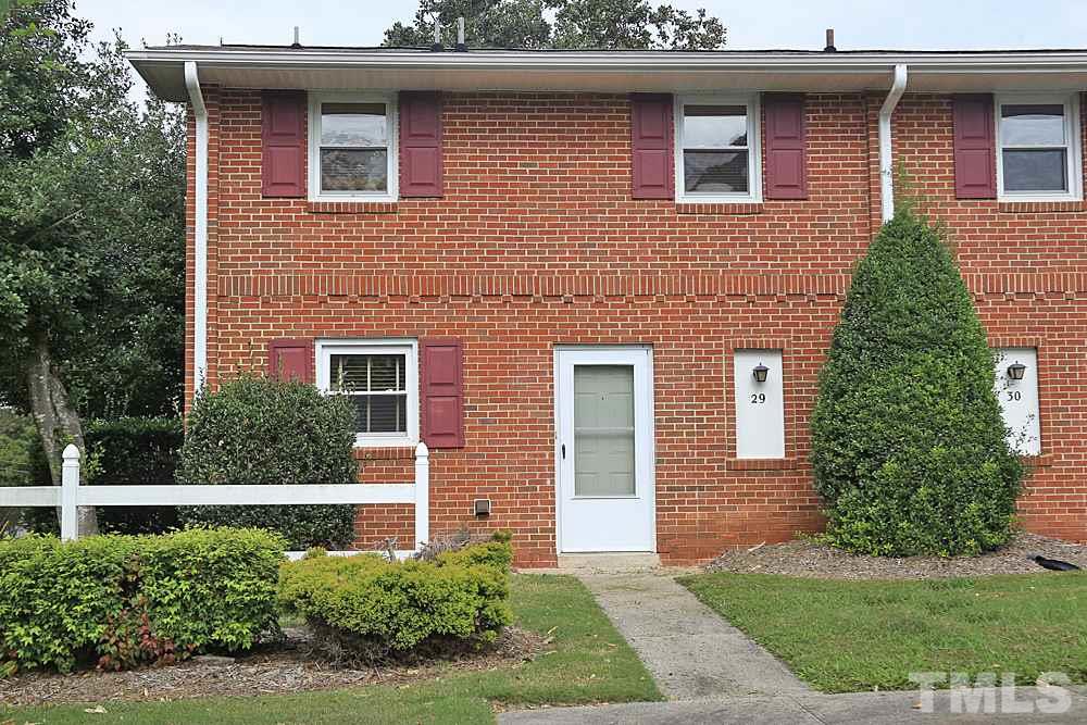 5141 Revere Road, Unit 29 Durham, NC 27713 - Photo 1 of 13 a front view of a house with a yard
