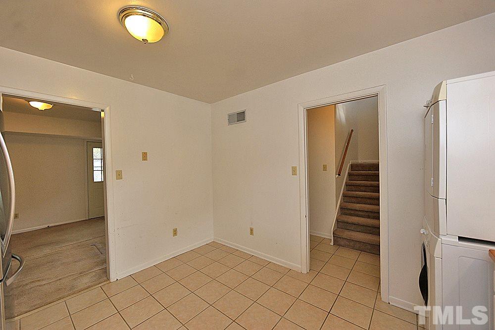 5141 Revere Road, Unit 29 Durham, NC 27713 - Photo 6 of 13 a view of an empty room with wooden floor and entryway