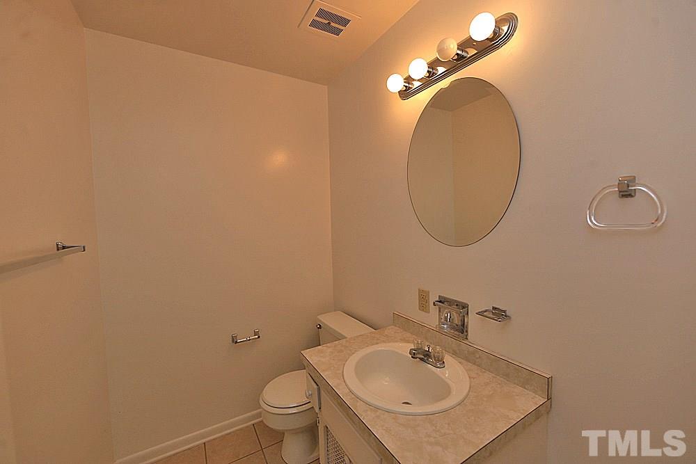 5141 Revere Road, Unit 29 Durham, NC 27713 - Photo 8 of 13 a bathroom with a sink and a mirror
