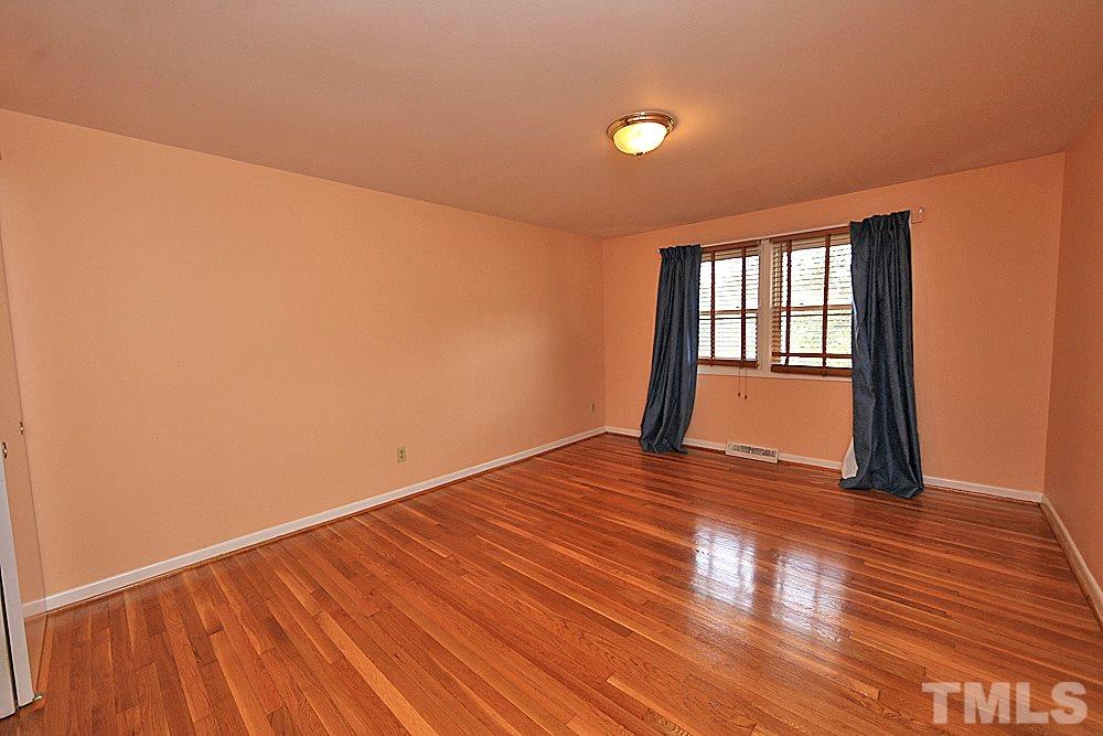 5141 Revere Road, Unit 29 Durham, NC 27713 - Photo 9 of 13 a view of empty room with wooden floor and fan
