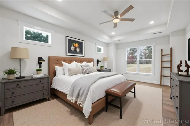 a spacious bedroom with a bed and a window