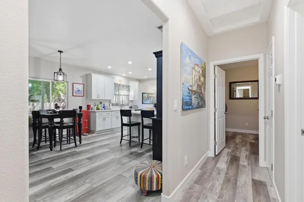 a view of a dining room with furniture window and wooden floor