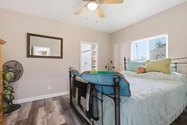 a bedroom with furniture and a window