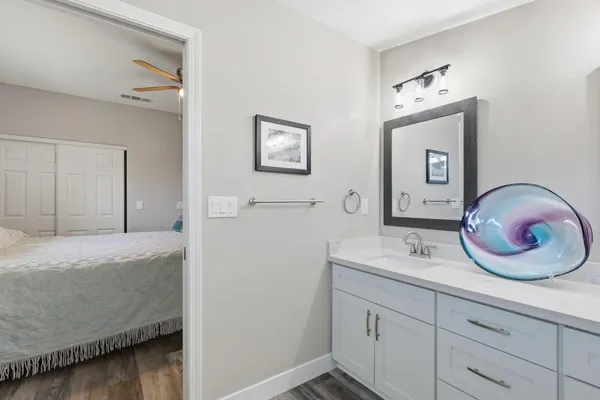 a bedroom with a bed and a mirror