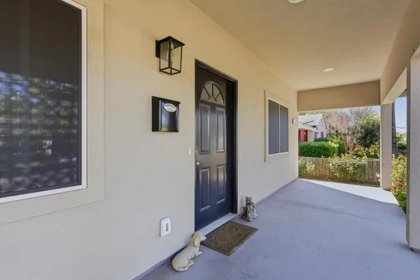 a view of an front door and wooden floor
