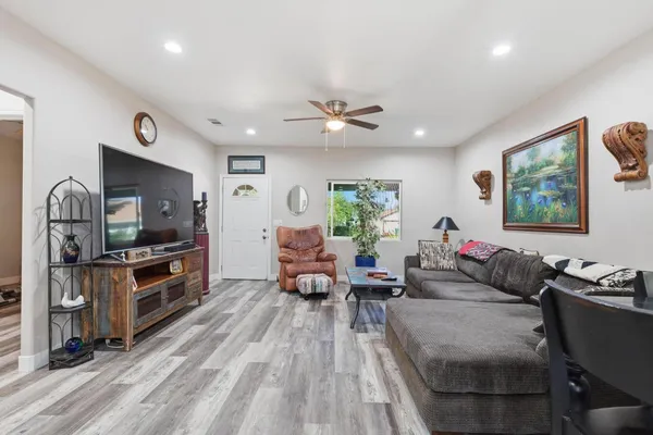 a living room with furniture and a flat screen tv