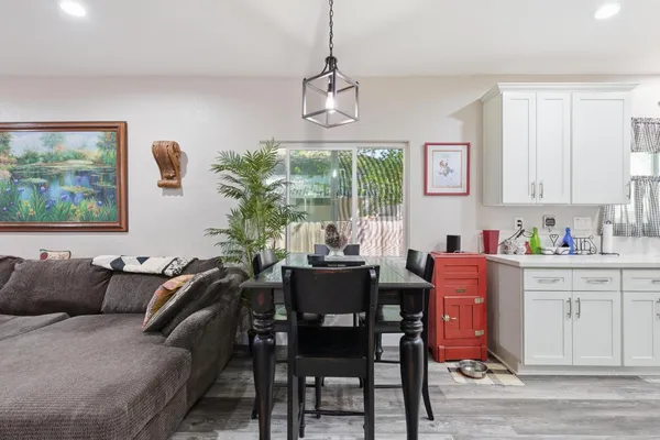 a dining room with furniture and window