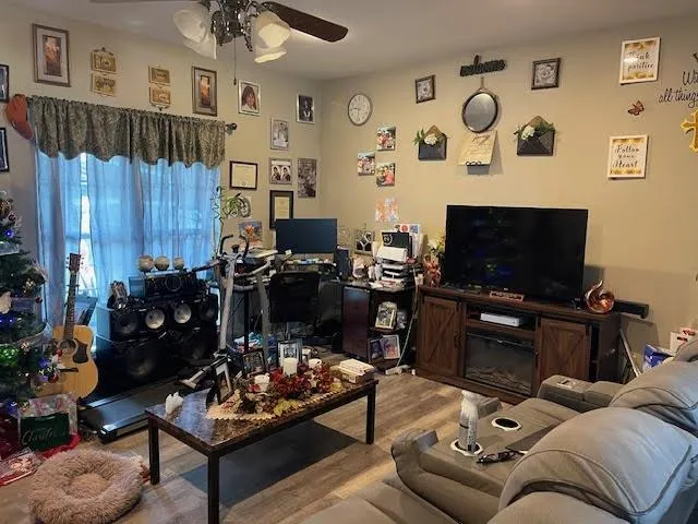 a living room with furniture and a flat screen tv