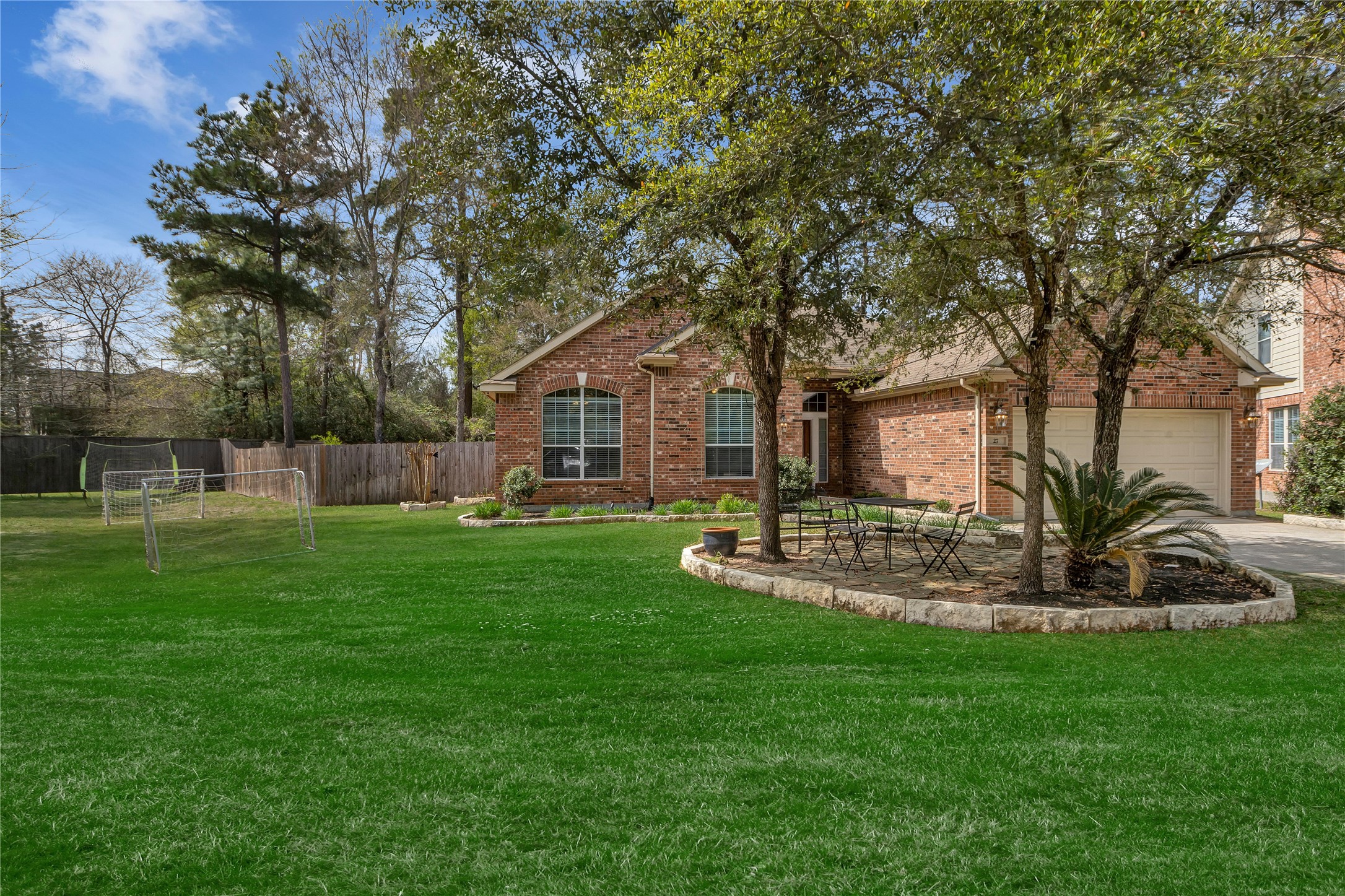 27 Planchard Court Spring, TX 77382 - Photo 16 of 16 a front view of a house with a yard and tree