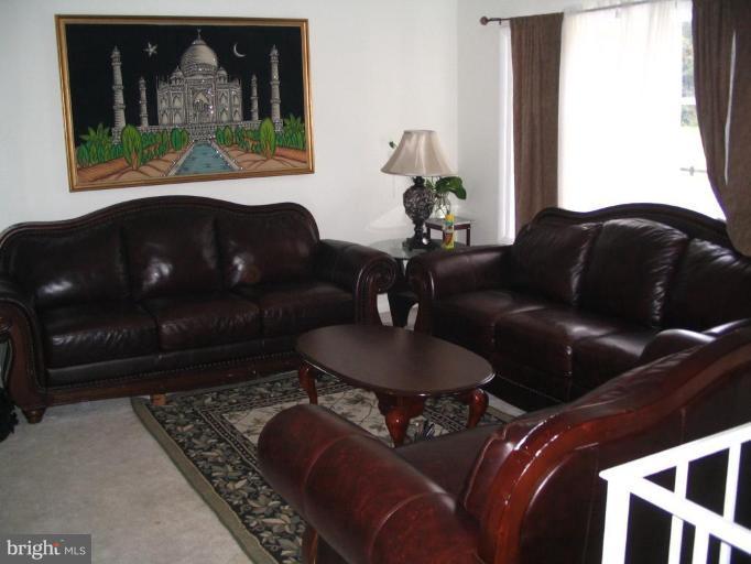 13456 Keytone Road Woodbridge, VA 22193 - Photo 2 of 3 a living room with furniture and a window