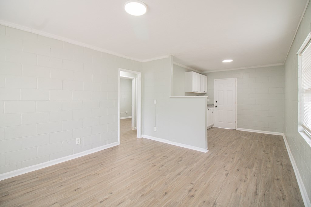 2408 16th Avenue, Unit A Columbus, GA 31901 - Photo 2 of 8 a view of an empty room with wooden floor