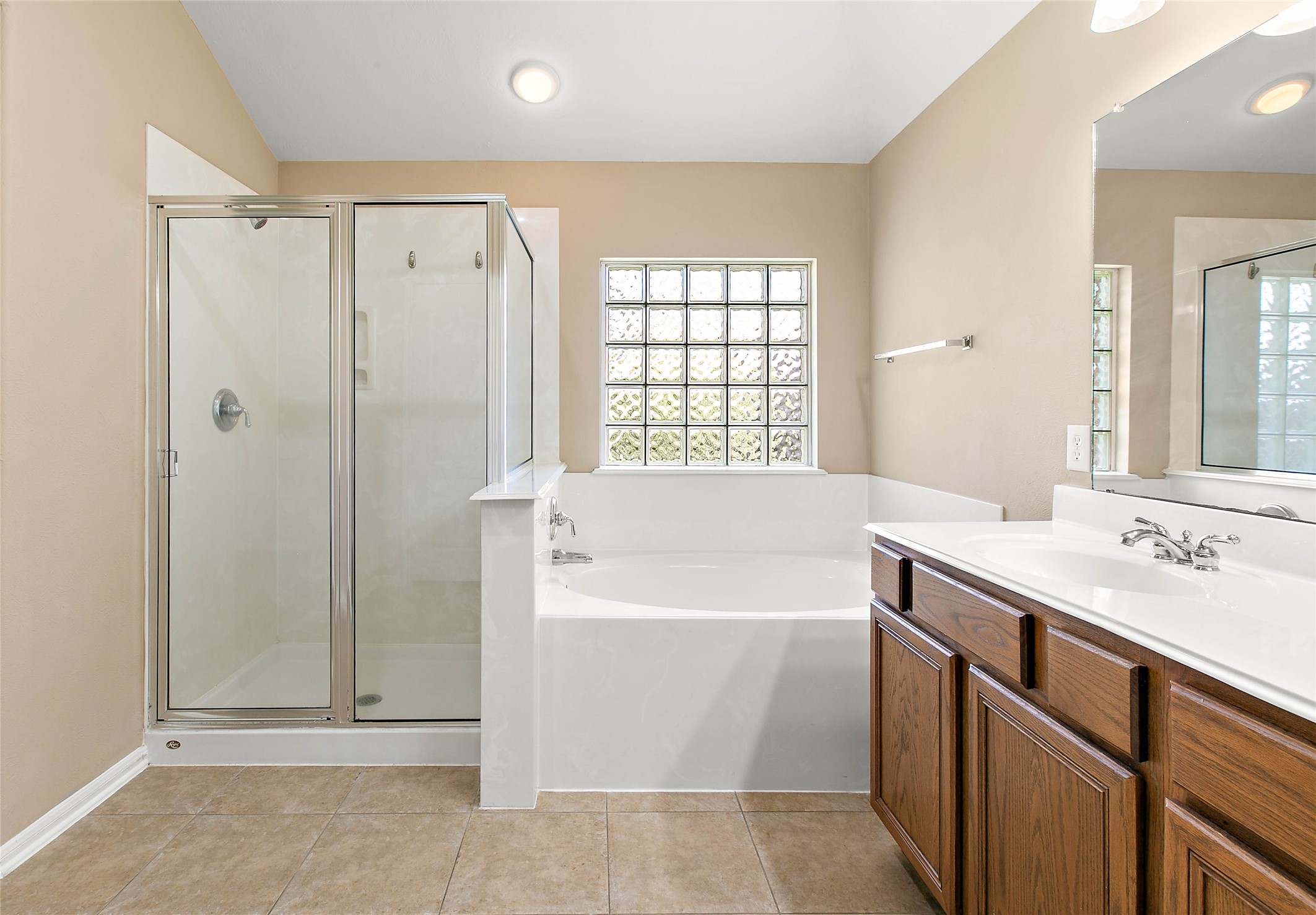30411 Deleon Fields Drive Spring, TX 77386 - Photo 16 of 24 Your private oasis featuring a separate shower and a soothing garden tub in the primary bath.