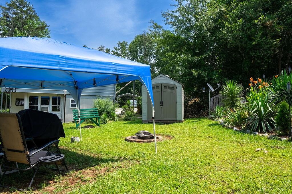 208 Reston Way Westminster, SC 29693 - Photo 17 of 32 This spacious backyard offers ample outdoor living space, perfect for entertaining or quiet enjoyment.