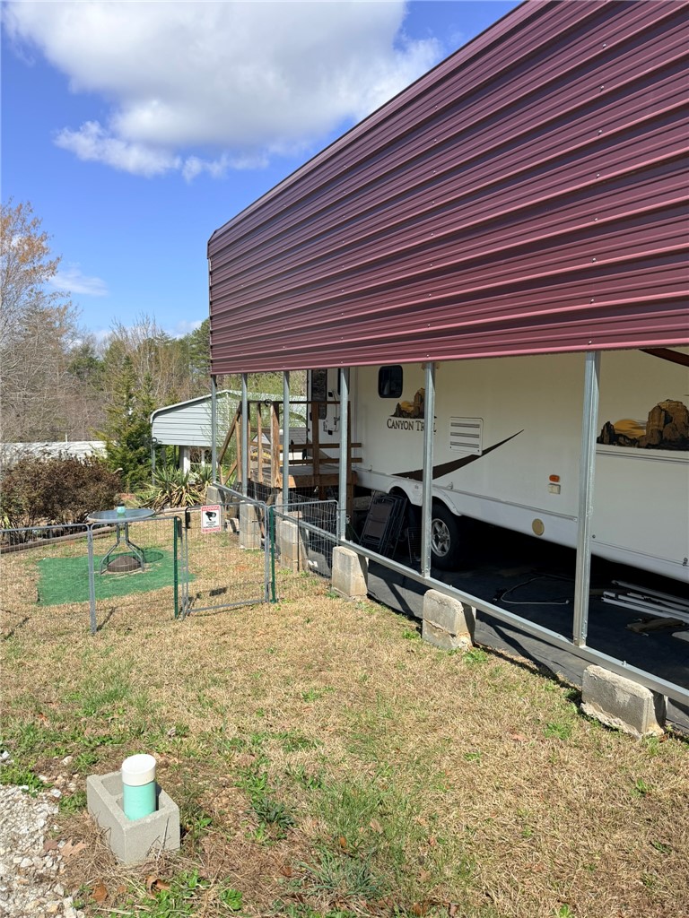 208 Reston Way Westminster, SC 29693 - Photo 20 of 32 This property features a covered outdoor area, offering versatile utility and protection.