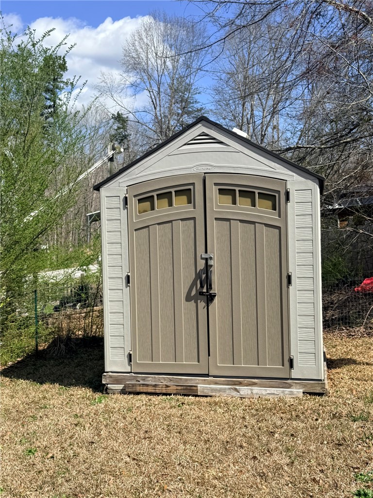 208 Reston Way Westminster, SC 29693 - Photo 21 of 32 This outdoor storage unit offers practical solutions for your outdoor essentials.