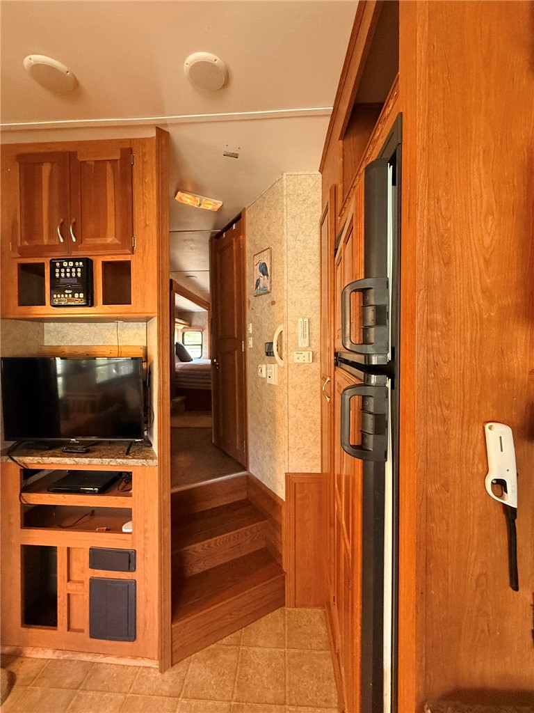 208 Reston Way Westminster, SC 29693 - Photo 4 of 32 This cozy living space offers practical design, with integrated appliances and warm wooden finishes.