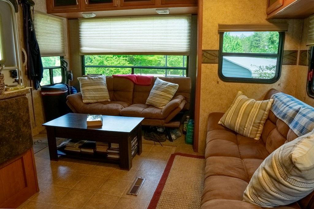 208 Reston Way Westminster, SC 29693 - Photo 5 of 32 This cozy living area features comfortable seating and ample natural light, creating an inviting atmosphere.