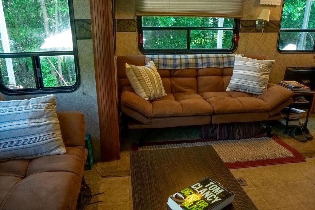 208 Reston Way Westminster, SC 29693 - Photo 7 of 32 This cozy living area features large windows framing lush outdoor views.