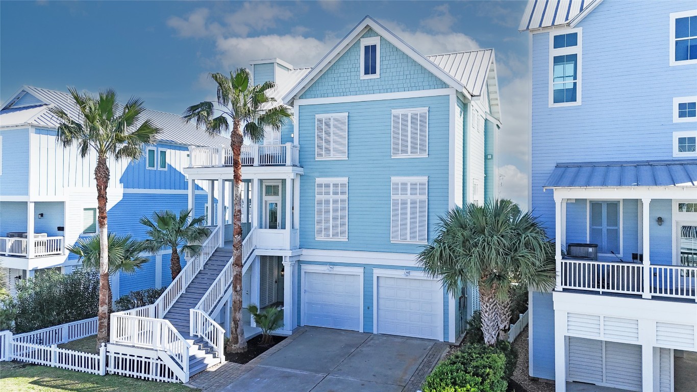 11610 Beachside Galveston, TX 77554 - Photo 1 of 50 a front view of a house with balcony