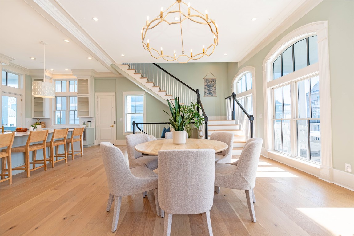 11610 Beachside Galveston, TX 77554 - Photo 15 of 50 a view of a dining room with furniture window and wooden floor