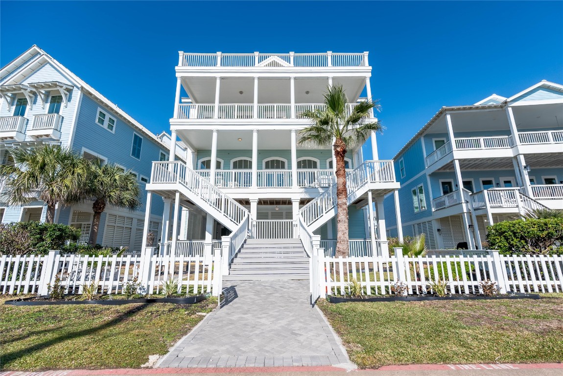 11610 Beachside Galveston, TX 77554 - Photo 3 of 50 a front view of a house with a garden